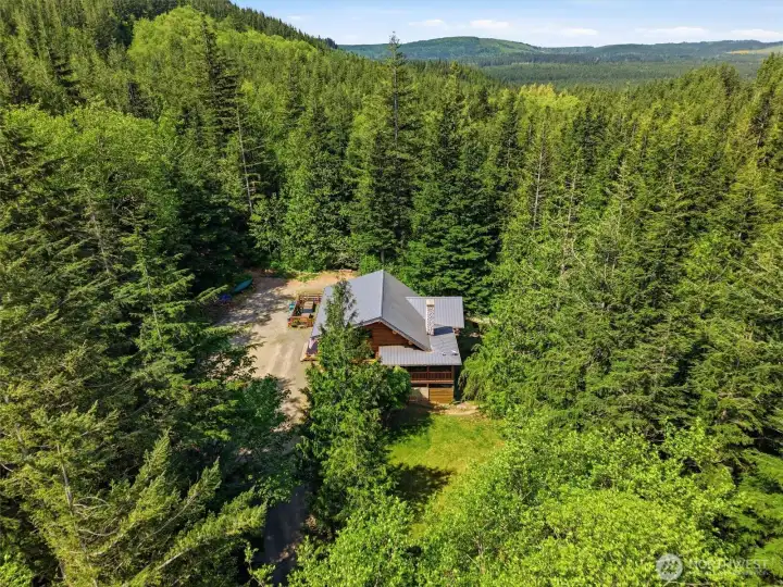 Over 6 acres of private unprecedented Northwest beauty
