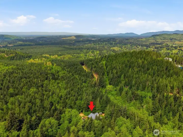 Over 6 acres of private unprecedented Northwest beauty