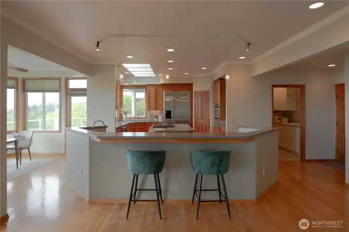 Large, well-laid-out chef's kitchen with cherry wood cabinetry
