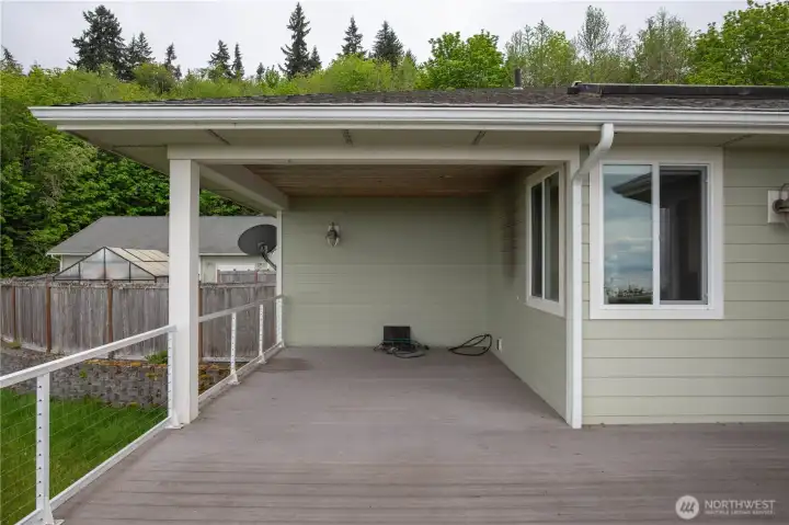 Covered barbecue deck with dedicated propane outlet — no portable tanks needed