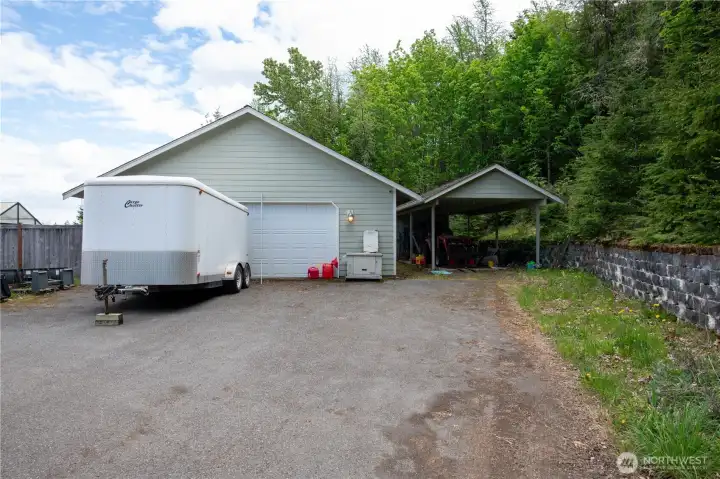 1,200 sq ft detached shop with ductless heat pump. Carport with attached storage in the back.