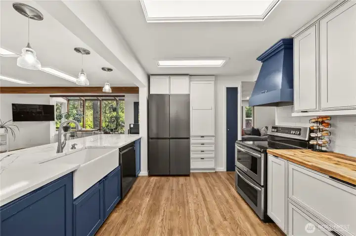 Skylights fill the kitchen with natural light. Check out that double oven!