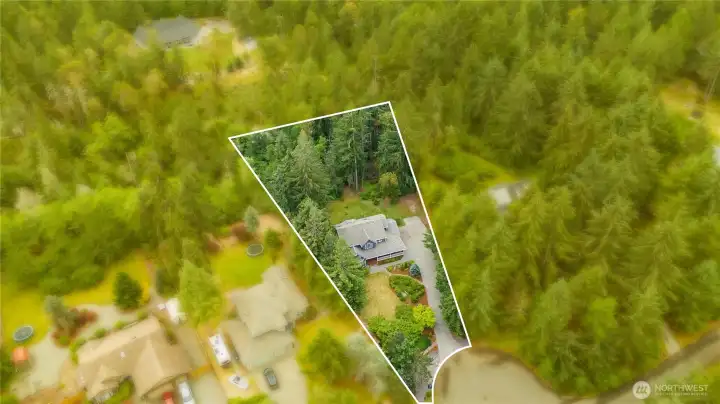 Aerial view highlighting the property's generous .77-acre lot. Approximate lot dimensions and boundary illustration.