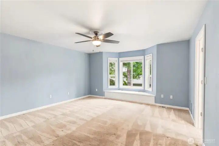 Additional bedroom with generous natural light and ample space.