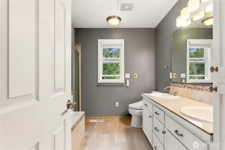 Spacious primary bath featuring dual sinks and abundant counter space.
