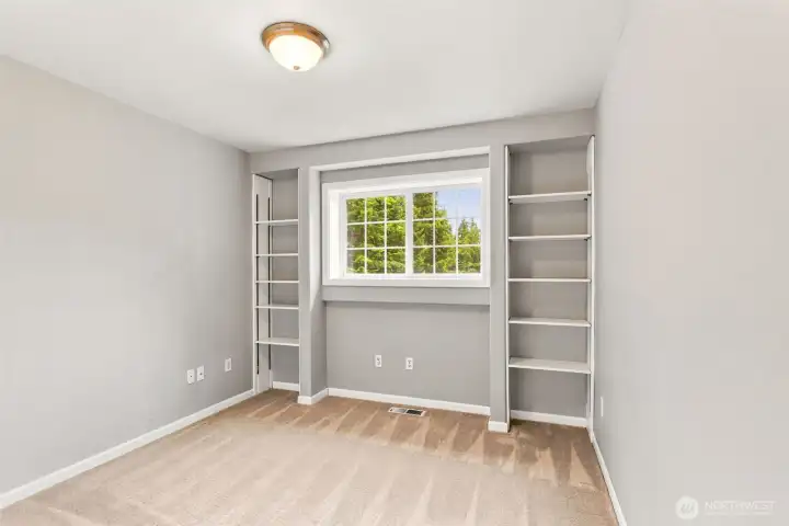 Versatile 4th bedroom or home office with built-in shelving.