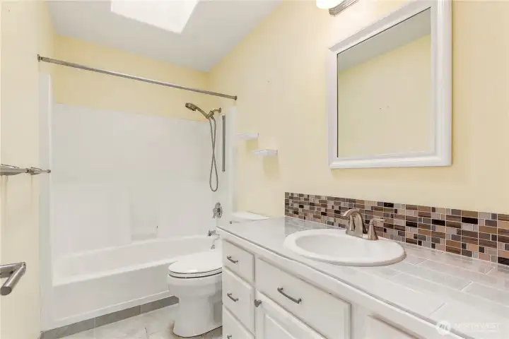 Full guest bathroom serving secondary bedrooms.