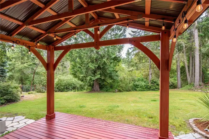 Covered outdoor gathering space ideal for year-round enjoyment.