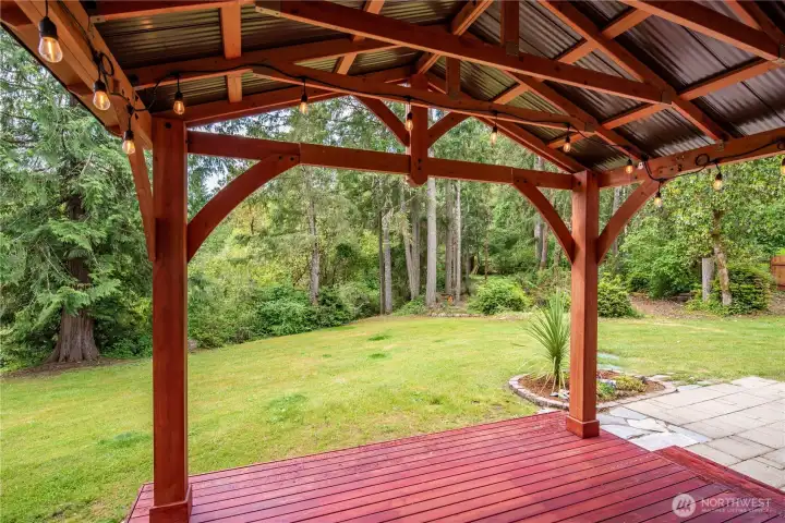 Outdoor living area overlooking the peaceful backyard setting