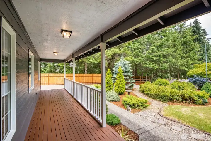 Covered front porch overlooking beautifully maintained landscaping.