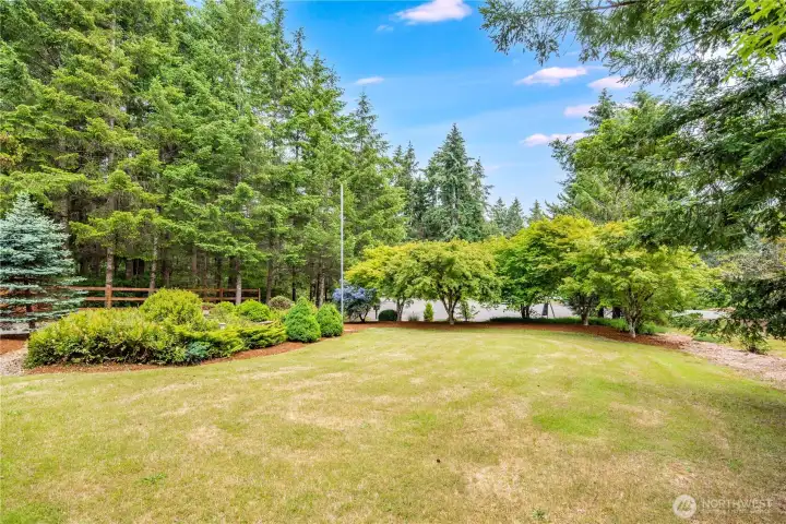 Spacious front yard with room for recreation, gardening, and gatherings.