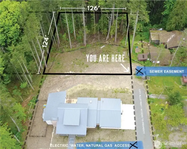 Aerial shot showing approximate boundary lines and approximate utility locations and how to access the property.