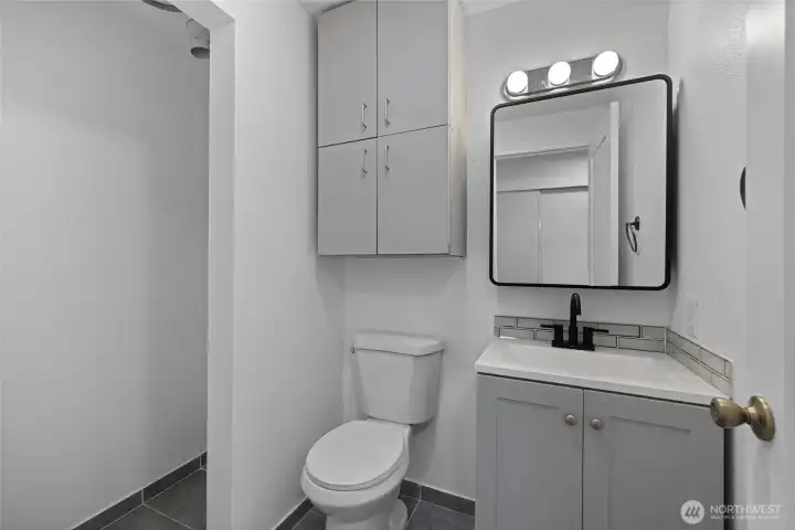 Half bathroom with hookups for your own washer and dryer