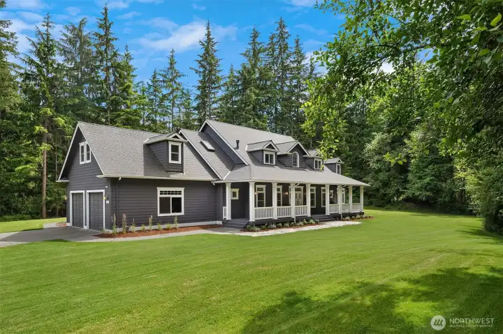 Move-in ready Woodinville home on an exceptionally private, level homesite with expansive lawns and timeless curb appeal.