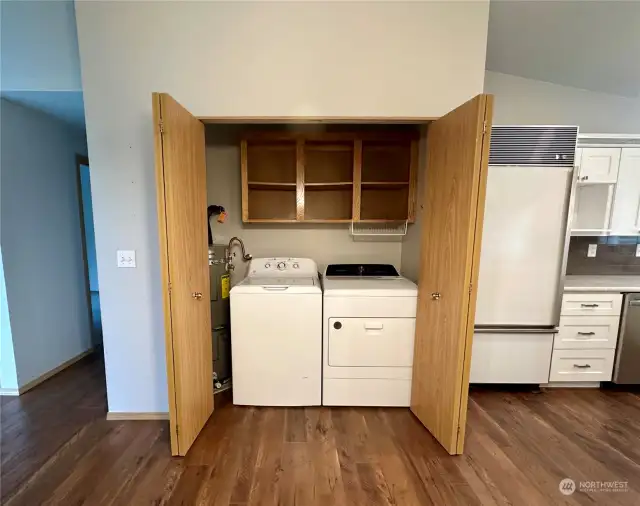 Utility closet with washer and dryer, plus storage