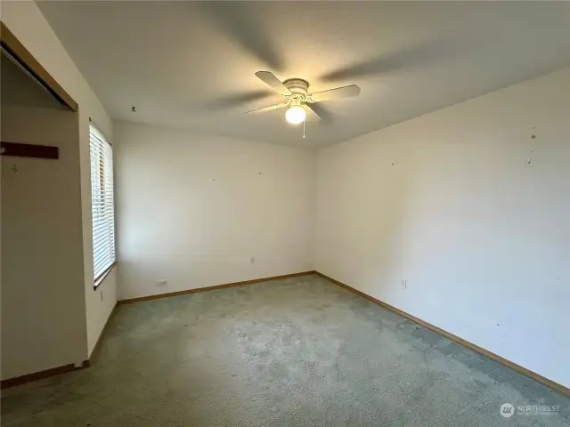 Third bedroom or home office with ceiling fan