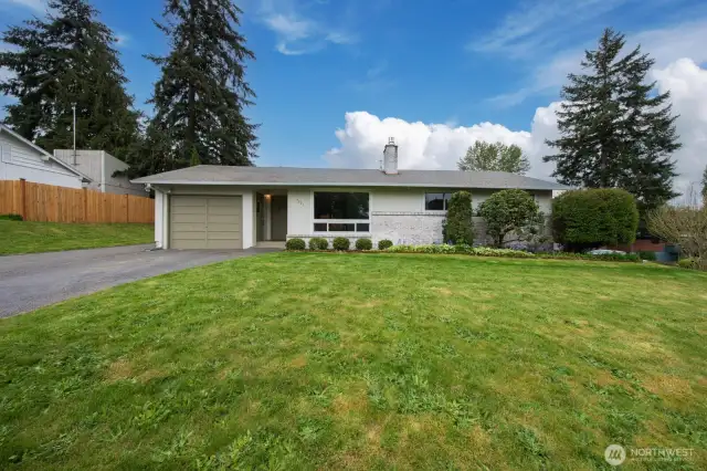 Home sits up on a large corner lot with great exposure