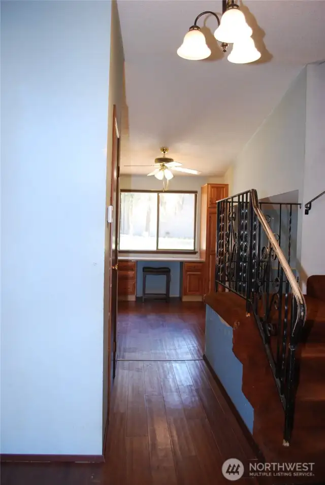 View from the entry.  Home is a tri level with steps down to the family room and all bedroom upstairs.