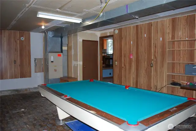 Two car garage is currently used as the recreation room.  Turn  this space into a fantastic entertainment area or remove the simple wall and restore it to a large garage!