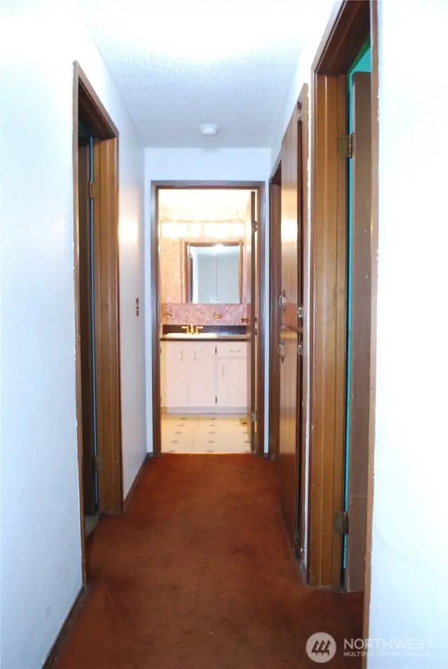 All bedrooms are upstairs with the main bath at the end of the hall.