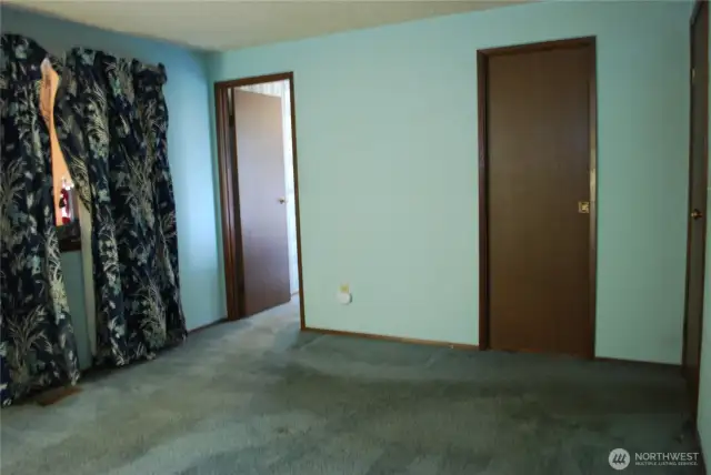Primary bedroom features a 3/4 bath and a walk-in closet.
