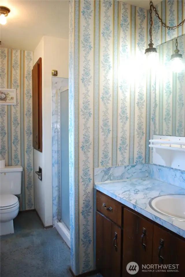 Primary bedroom features a 3/4 bath and a walk-in closet.