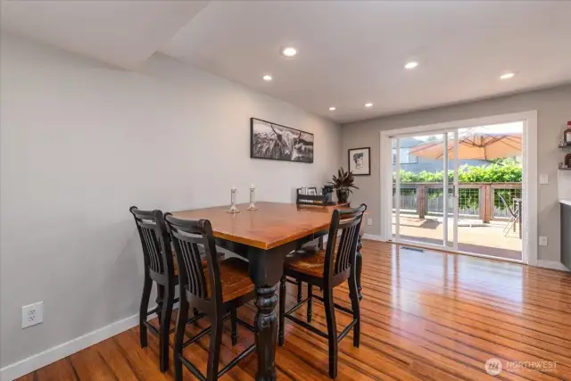 The shining, custom Bamboo floors extend to the informal dining area, all the way to the slider leading you out to the huge back deck.
