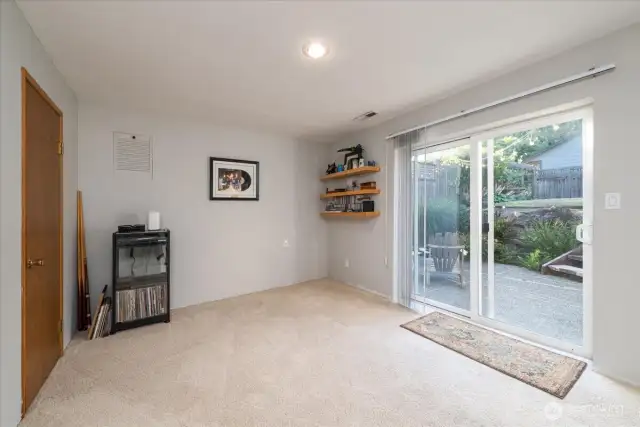 The lower level bonus room opens out to the private lower patio for enjoying a quiet evening.