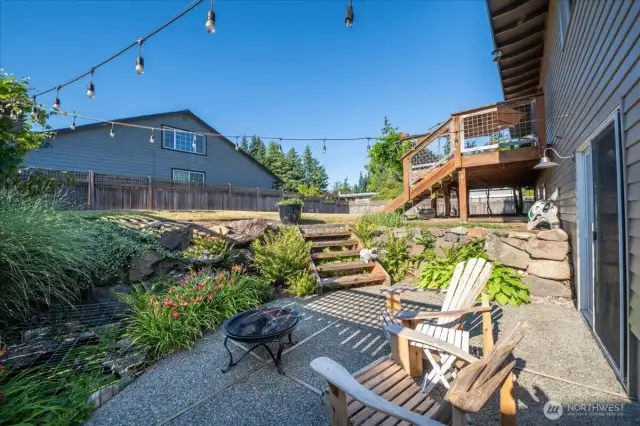 Lower patio for a tranquil moment alone, or making a lively memory with loved ones.