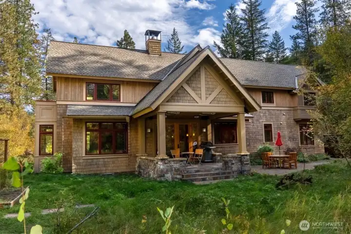 Grand slate stone-accented entry sets a warm and refined tone.