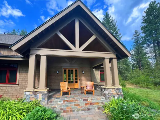 Grand slate stone-accented entry sets a warm and refined tone.