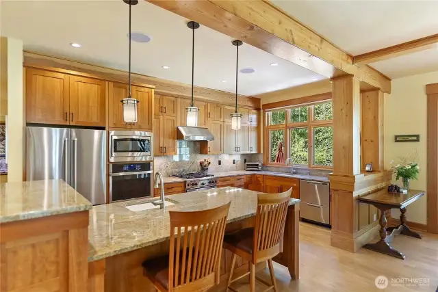 Chef’s kitchen with Wolf range, cherry cabinets, and granite countertops.
