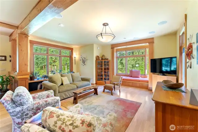 Open-concept great room features 9’+ ceilings and radiant heated floors.