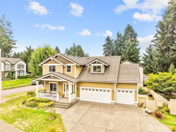 Welcome to 9209 Vancouver Dr NE in Meridian Campus. This large corner lot has beautiful stone steps down to a huge patio is mature landscaping.