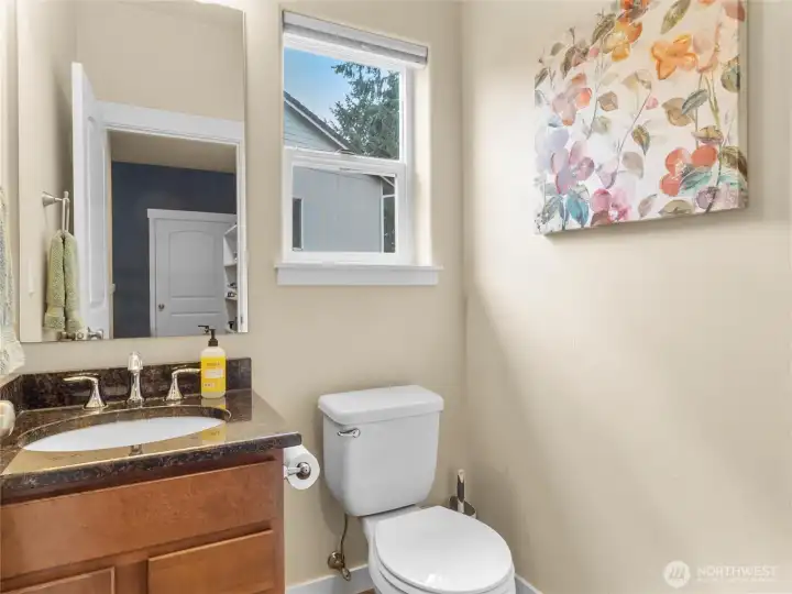 Powder room with granite counter.