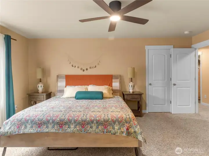 Upstairs we have the primary bedroom with walk-in closet, french doors and 5-piece en suite bathroom
