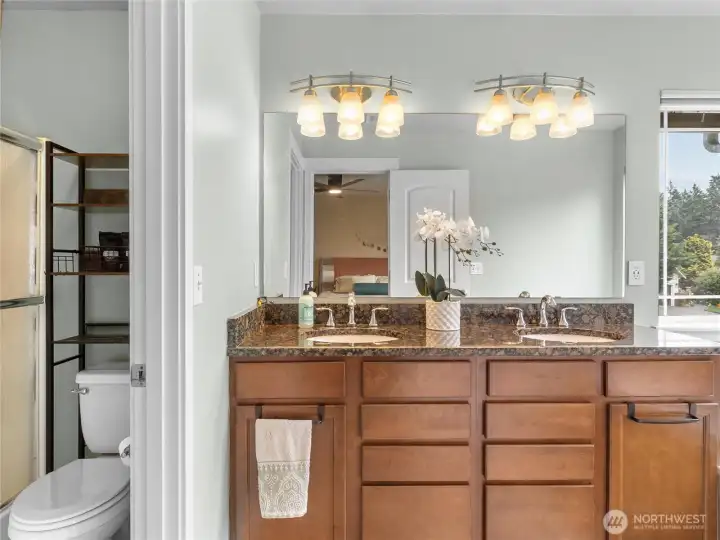 Primary Bathroom is split into two spaces, allowing multiple users.