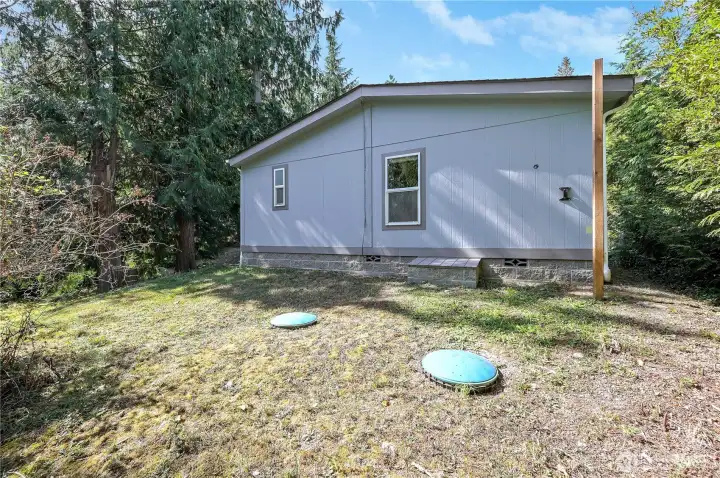Back side of house. Septic risers