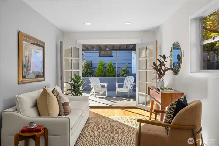 Great room off of the kitchen with french doors opening to backyard