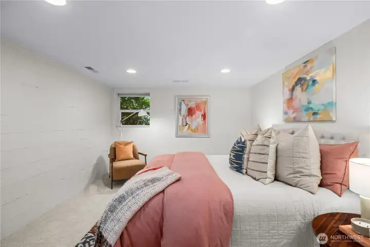 Large lower level bedroom with a walk-in closet