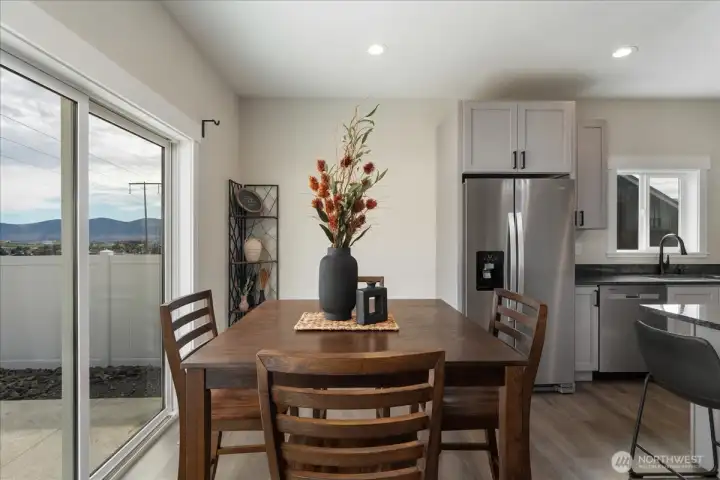 Eating space with sliding door access to backyard.