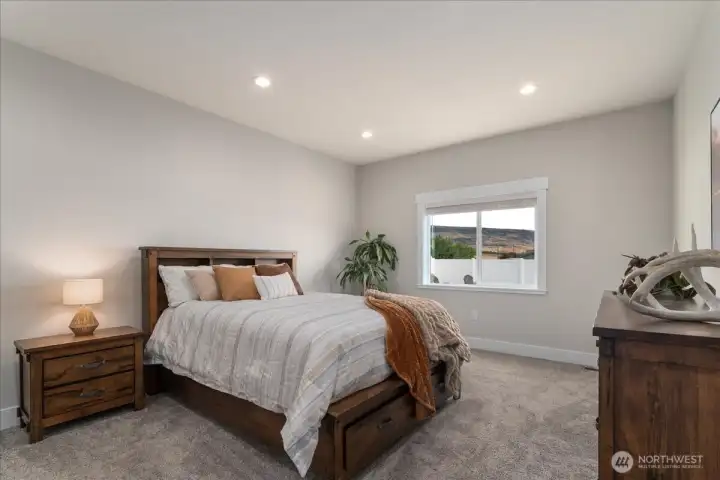 Spacious primary suite with room to unwind.