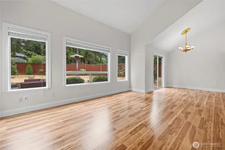 Open concept plan for main living area. Includes living room, diing area, kitchen, 3rd bedroom and/or office