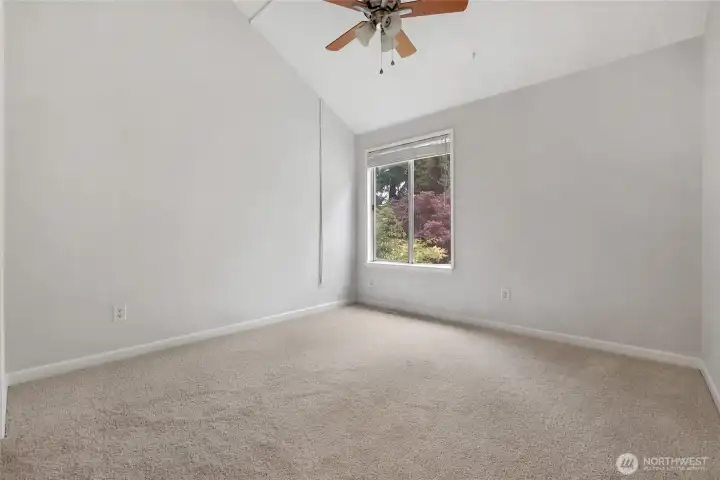 Primary bedroom with walk in closet and en suite bathroom