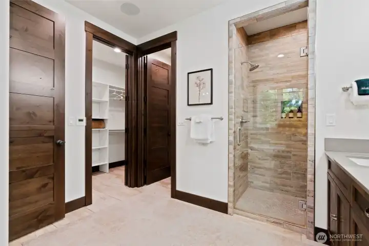 Primary walk in shower and closet