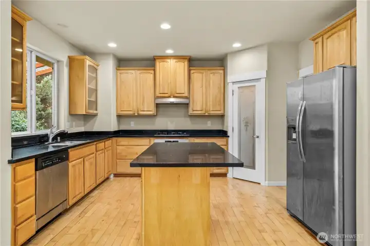 Conversational Kitchen with walk in pantry and island.
