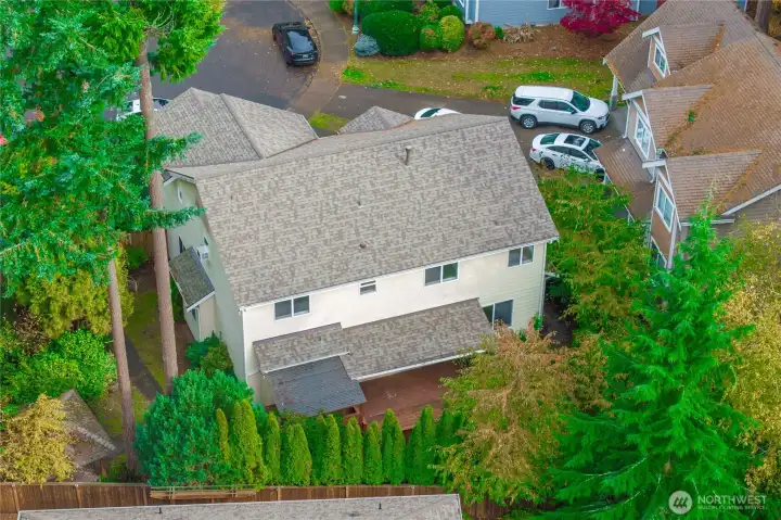 Aerial view shows the newer roof and private backyard.