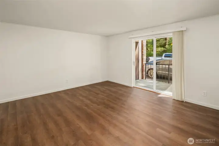 Living Room leads to covered patio w/storage