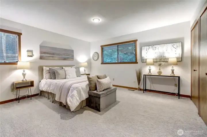 Spacious main floor Primary Bdrm w/ ensuite bath