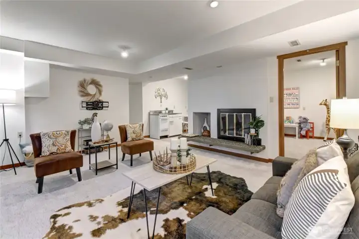 Lower level family room w/ fireplace OR 1 bedroom apartment w/ Kitchen!